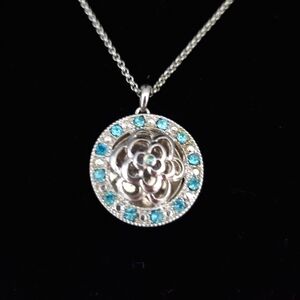 Silver Floral Necklace with Round Medallion & Blue Topaz Stones